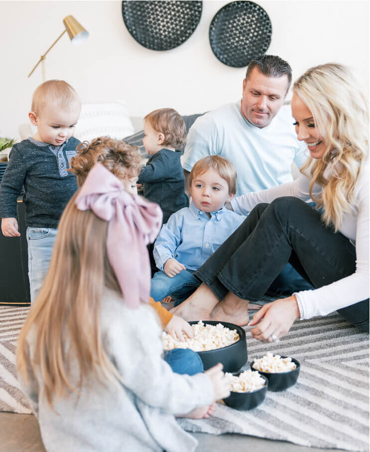 The Deebles on the floor with the kids, popcorn night